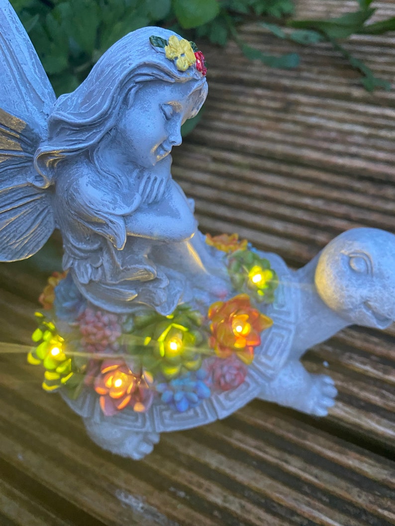 Solar-powered fairy and turtle decorative lamp sculpture