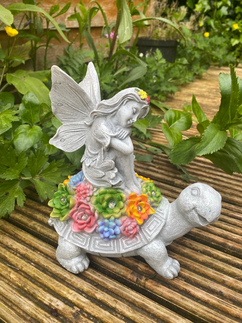 Solar-powered fairy and turtle decorative lamp sculpture