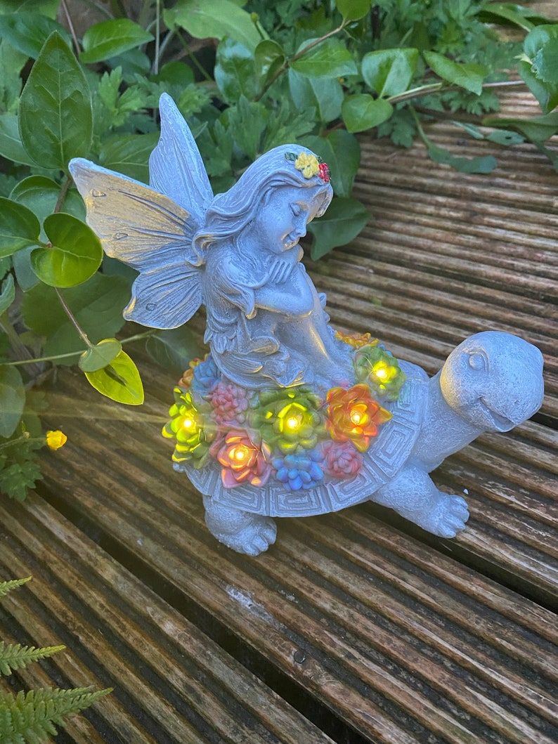 Solar-powered fairy and turtle decorative lamp sculpture
